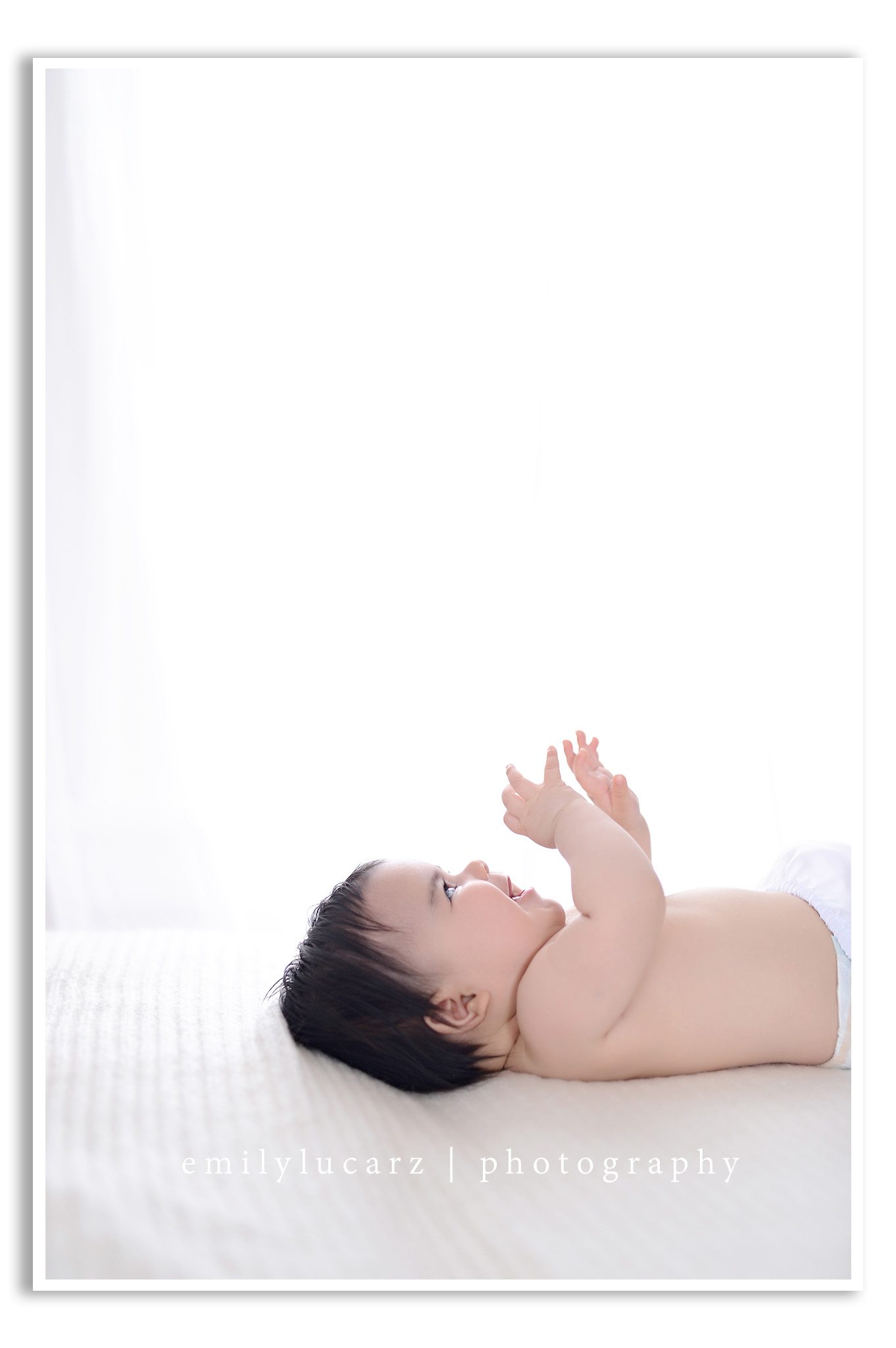 A darling 4 month old girl who had her photo taken in a yellow dress for a baby photography session in St. Louis MO