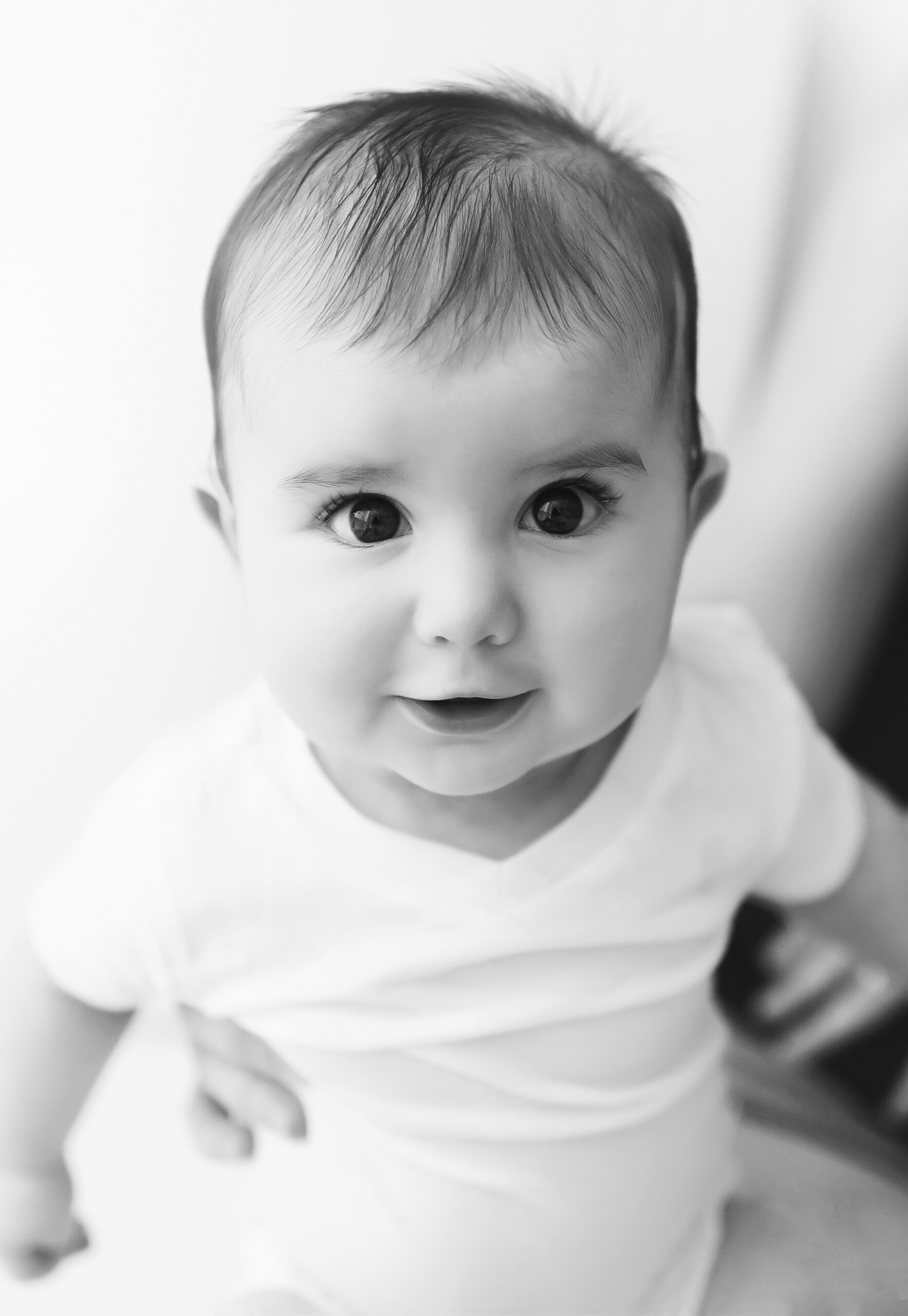 black and white photo of toddler with long eyelashes