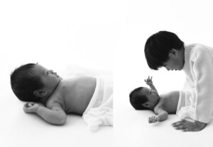 Older brother interacting with awake newborn during studio session in Wildwood Missouri